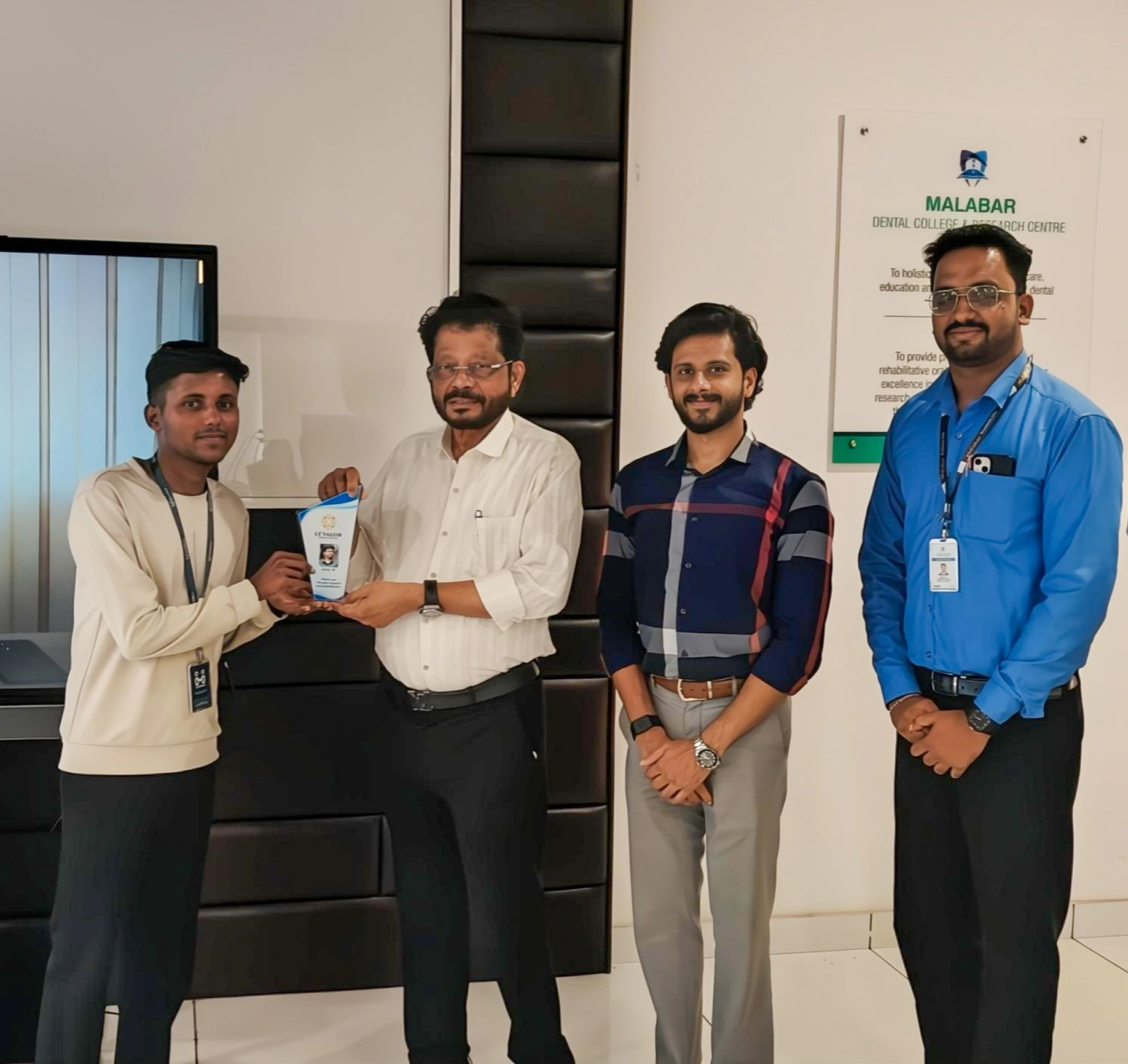 Muhammed Afsal receiving recognition with the Le’Valor software delivery team